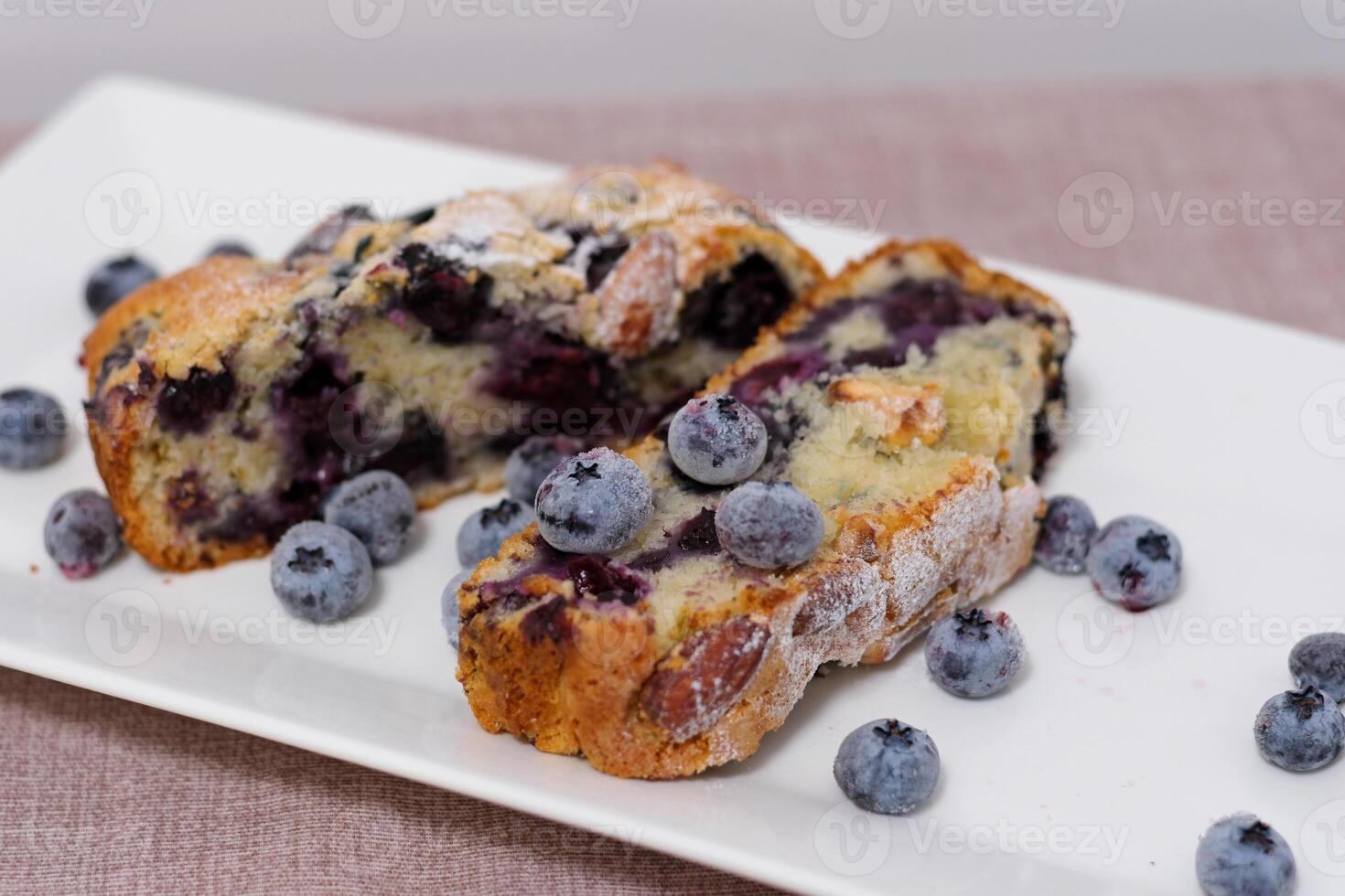 holly berries in pies Pandoro and Panettone cake traditional Italian Christmas sweets on wooden background copy space. photo