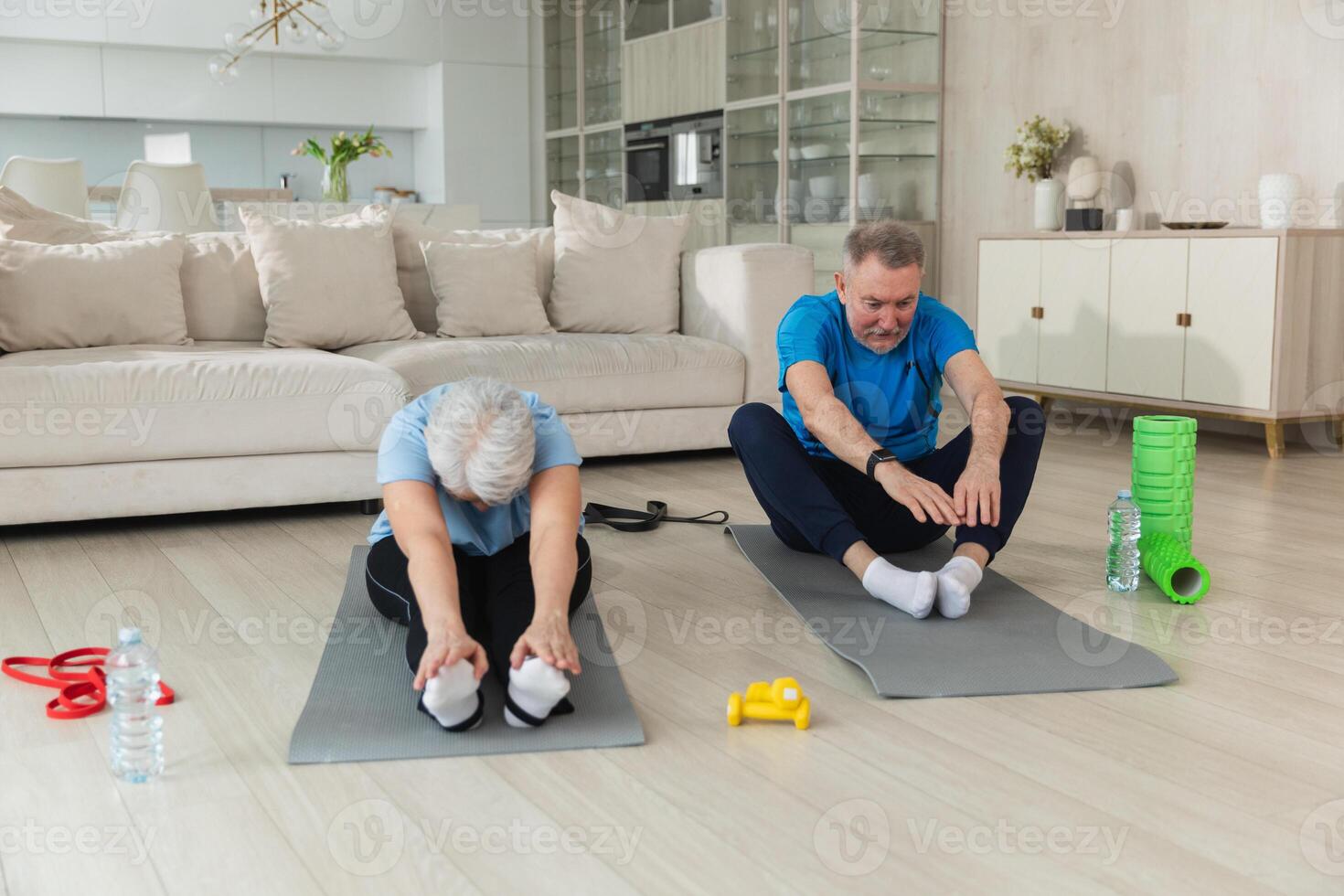 Fitness workout training. Senior adult mature healthy fit couple doing sports exercise on yoga mat on floor at home. Mid age old husband wife have training workout. Health care healthy lifestyle photo