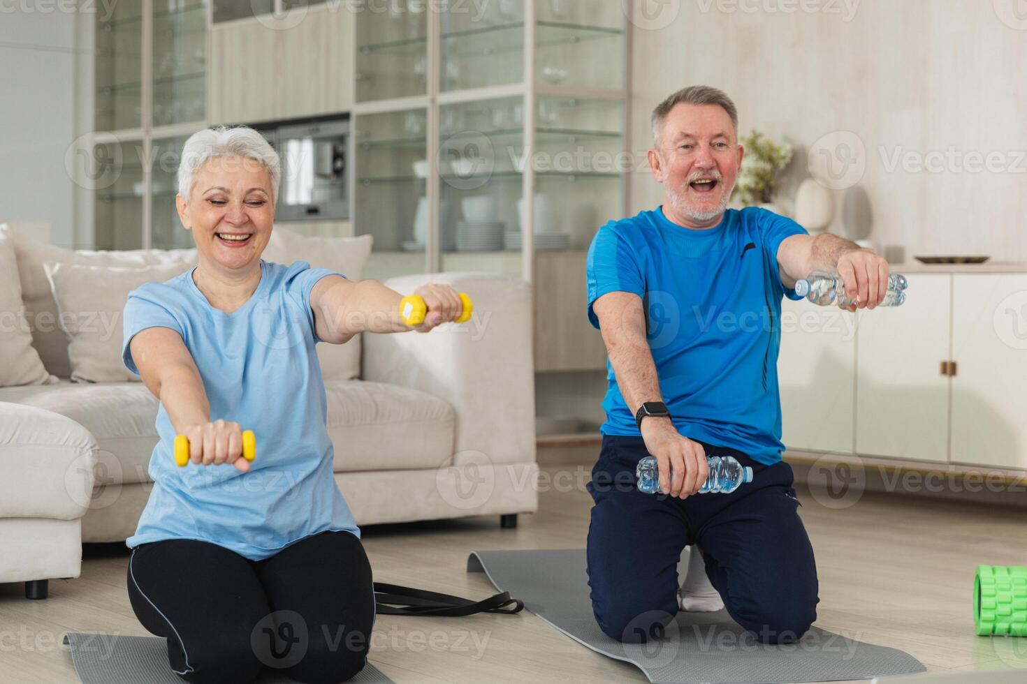Fitness workout training. Senior adult mature healthy fit couple doing sports exercise on yoga mat on floor at home. Mid age old husband wife have training workout. Health care healthy lifestyle photo