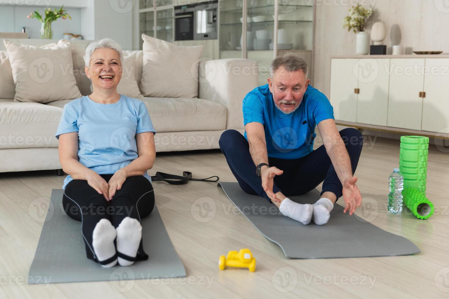 Fitness workout training. Senior adult mature healthy fit couple doing sports exercise on yoga mat on floor at home. Mid age old husband wife have training workout. Health care healthy lifestyle photo