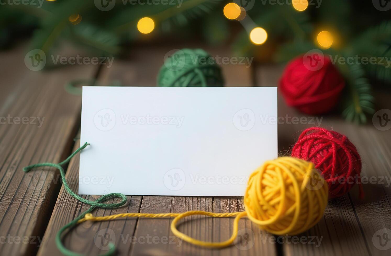 Cozy Christmas card with colorful yarn balls and festive lights on wooden table photo