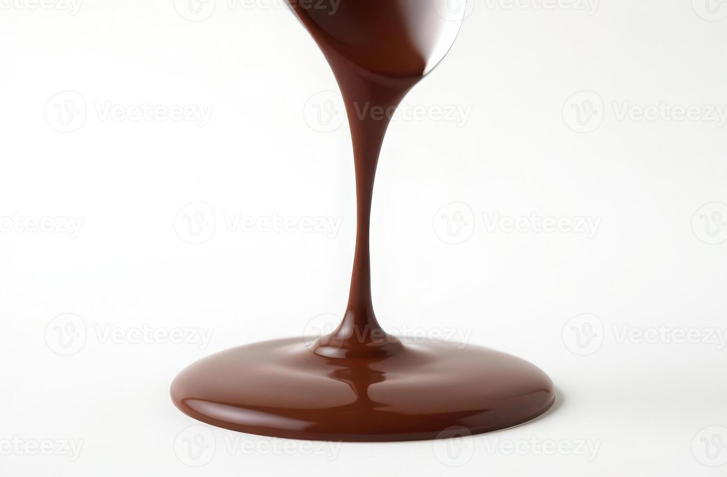 Smooth flowing chocolate stream on white background. perfect for food and dessert themes photo