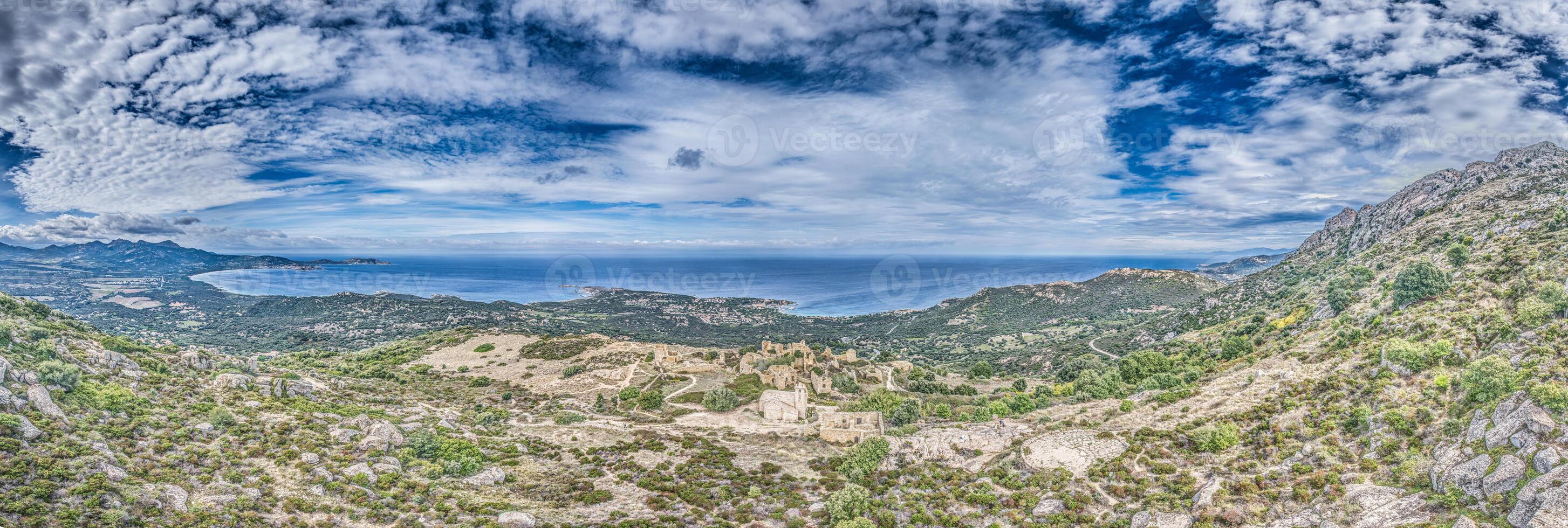 Panoramic drone view of the western Corsican coastline and the abandoned historic village of Occi photo