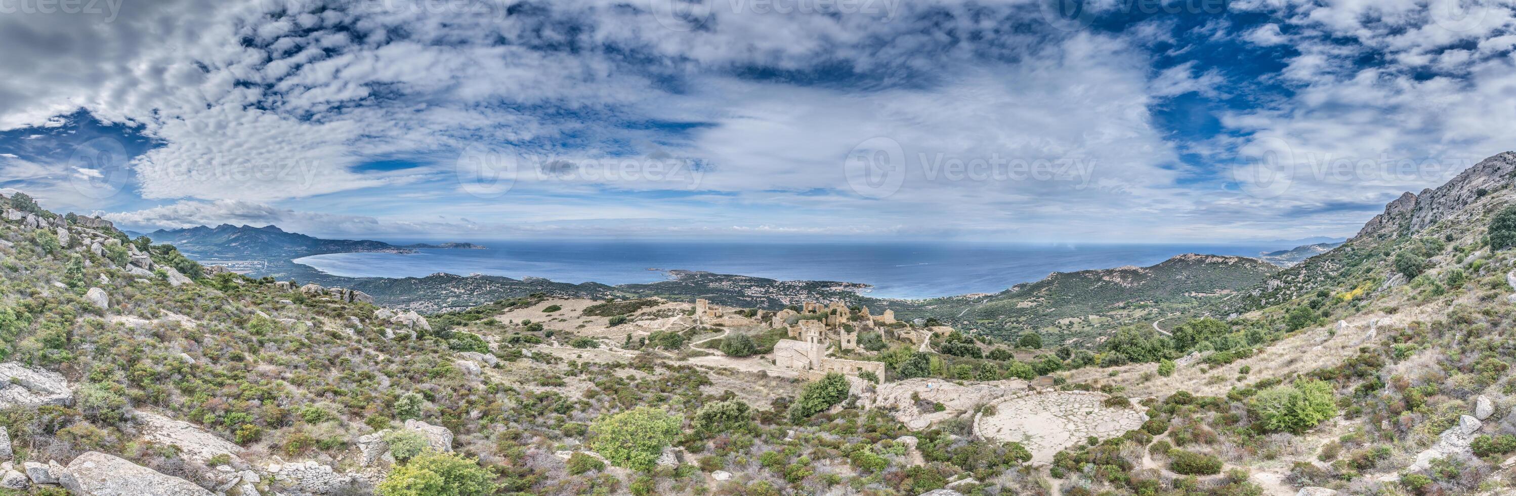 Panoramic drone view of the western Corsican coastline and the abandoned historic village of Occi photo