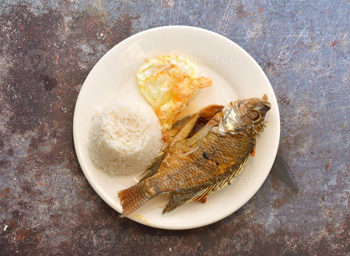 Fried Tilapia with Rice and Egg, a classic Filipino comfort food photo