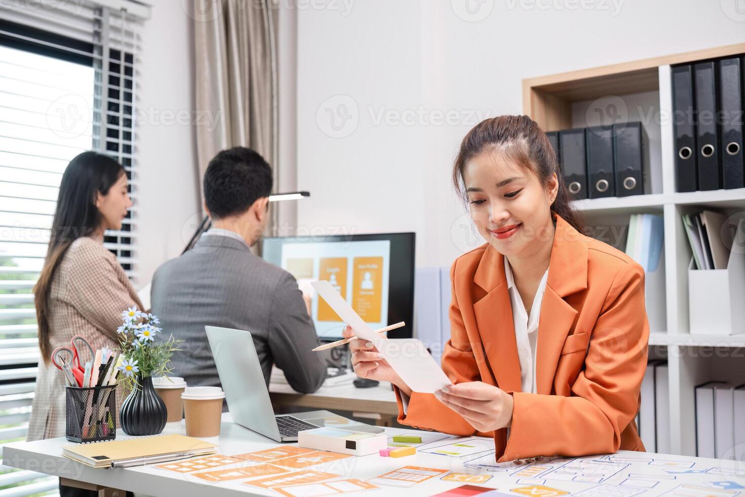 Program Developer Team Collaborates on UXUI Design in Modern Office Setting photo