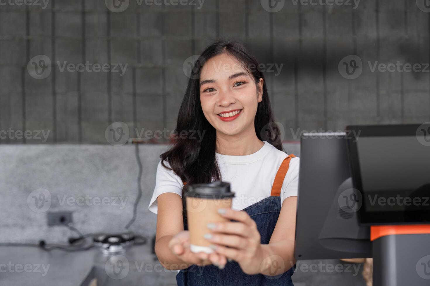 Young Barista Crafting a Perfect Cup of Coffee in a Modern Cafe Setting with a Focus on Skill and Passion for Quality Brewing photo