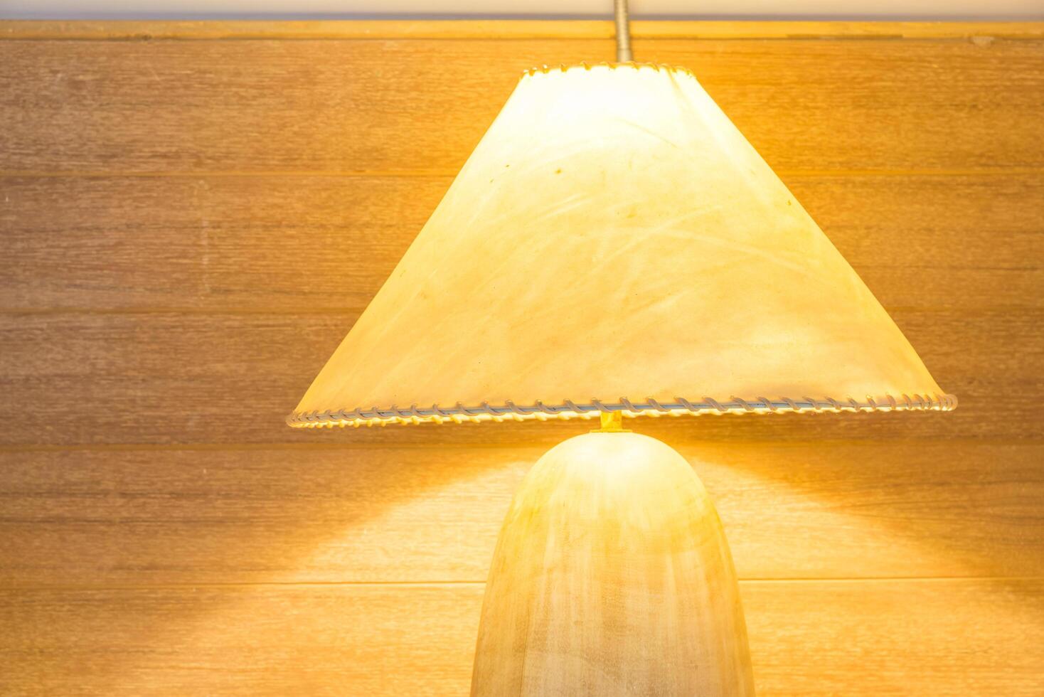 A lamp sitting on a table next to a lamp photo