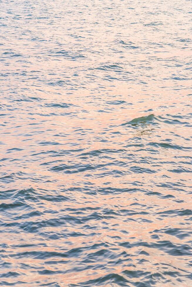 A man on a surfboard in the ocean photo