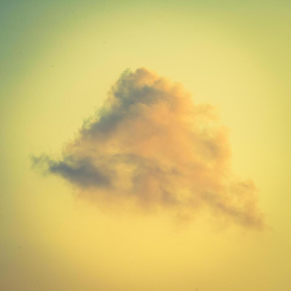 A plane flying in the sky with a cloud in the background photo
