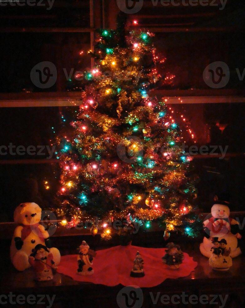 Christmas Tree Decorated with Ornaments and Evergreen Branches photo