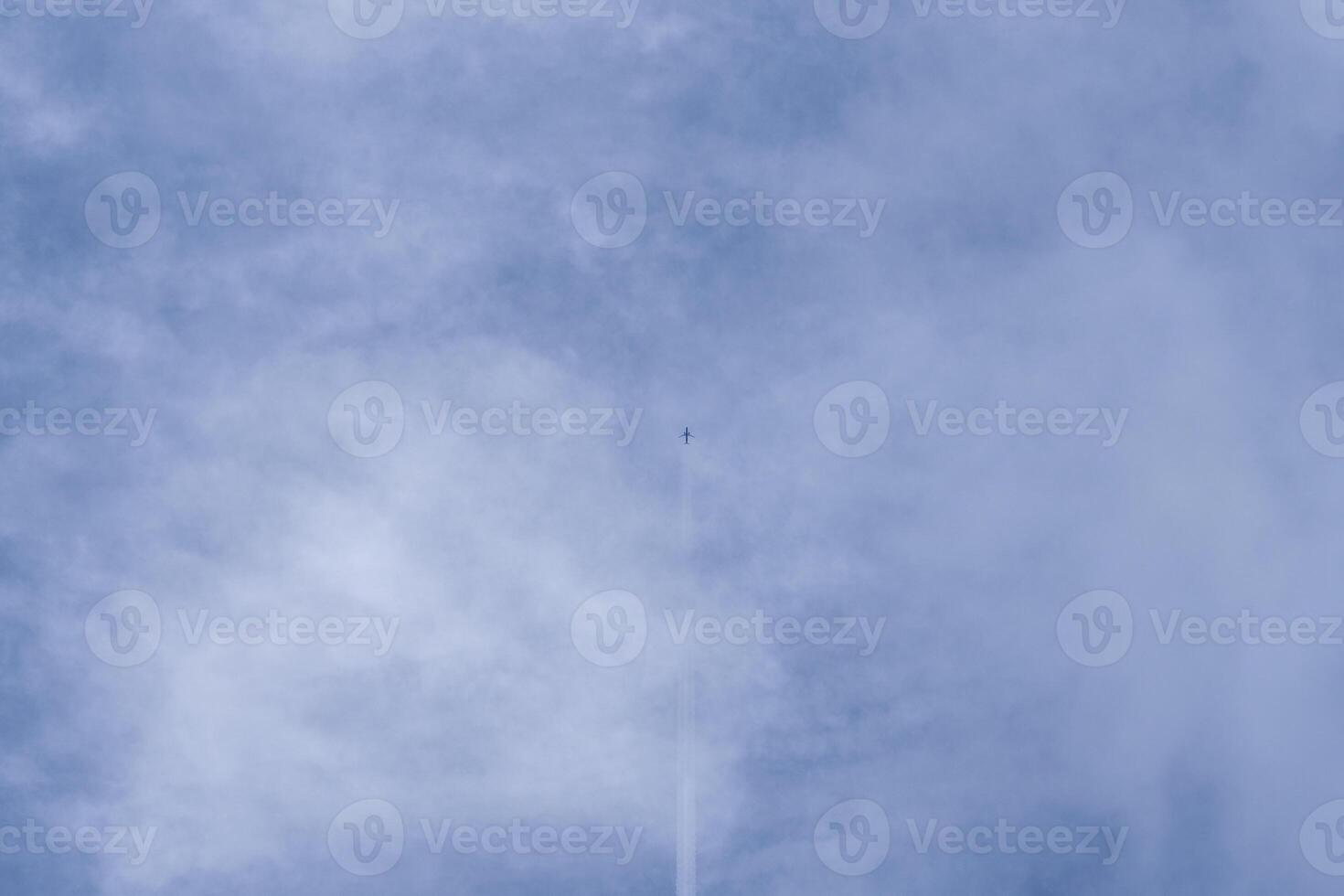 Airplane with white cloud on light blue sky in summer. photo