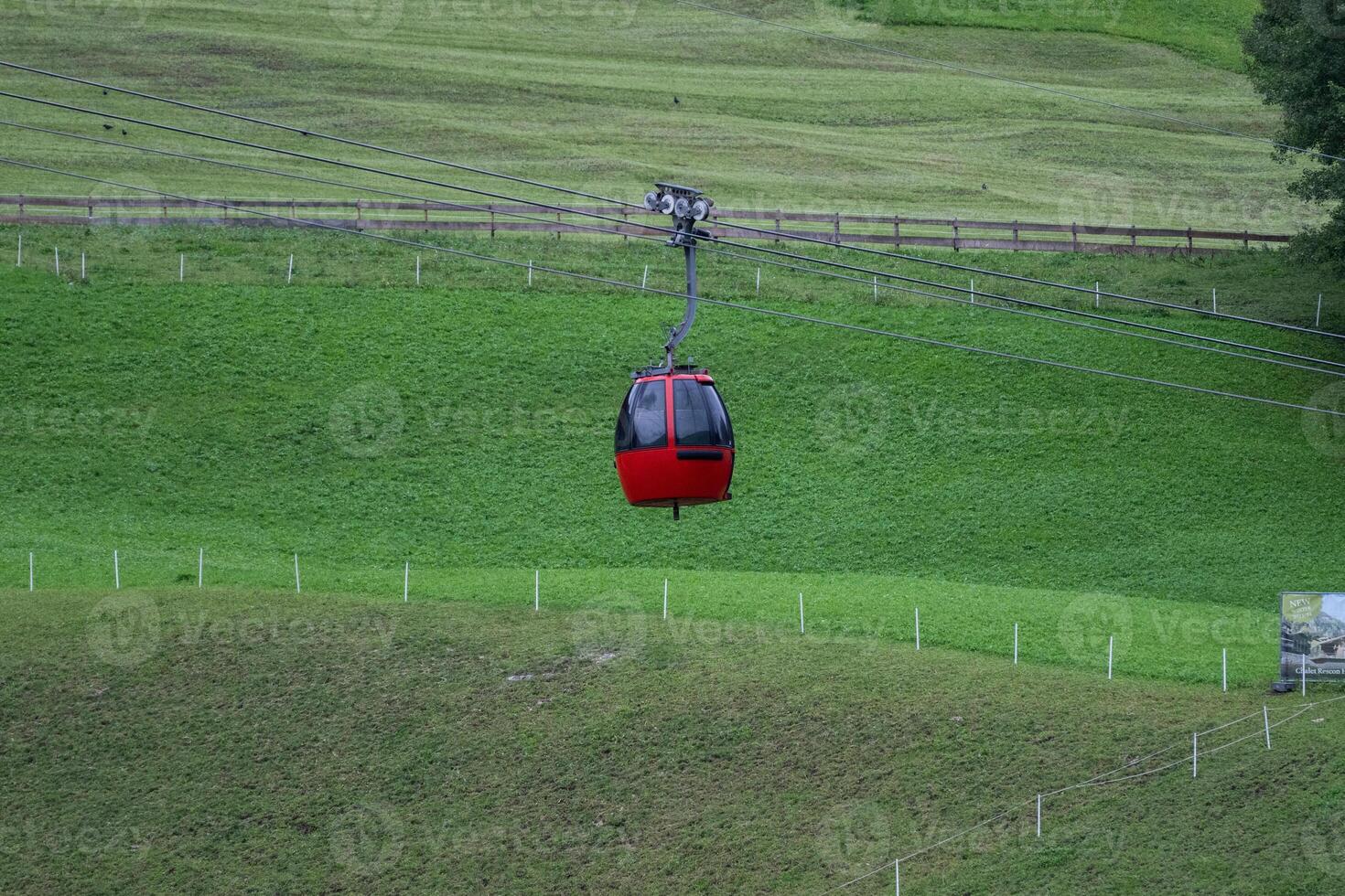 Red cable car to the Alpe di siusi from Ortisei Dolomites, Italy photo