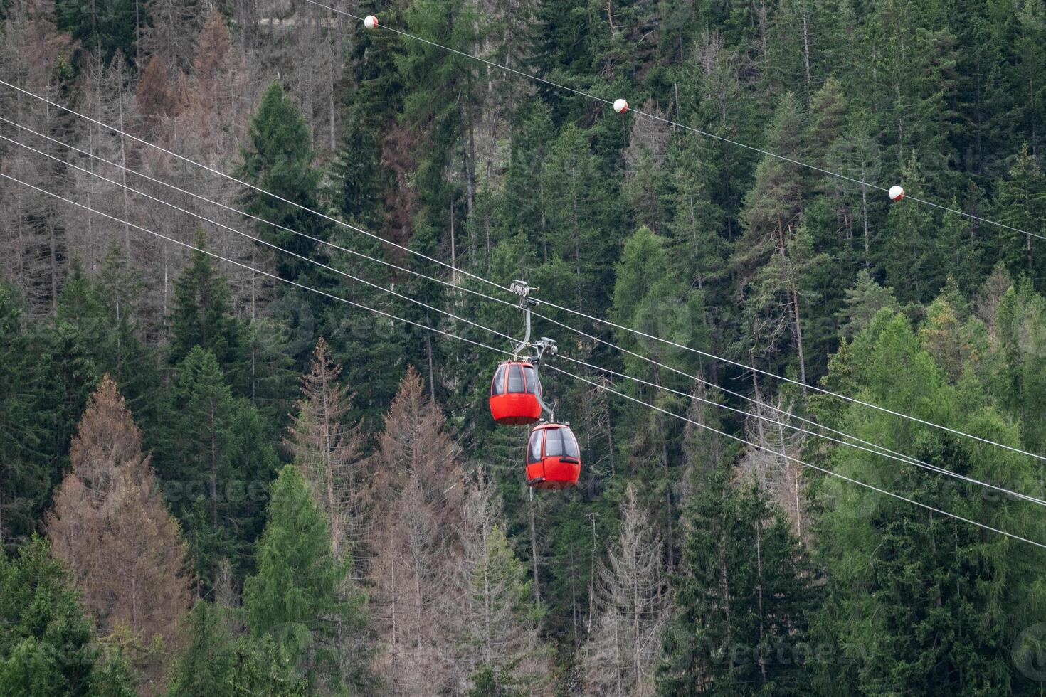 Red cable car to the Alpe di siusi from Ortisei Dolomites, Italy photo