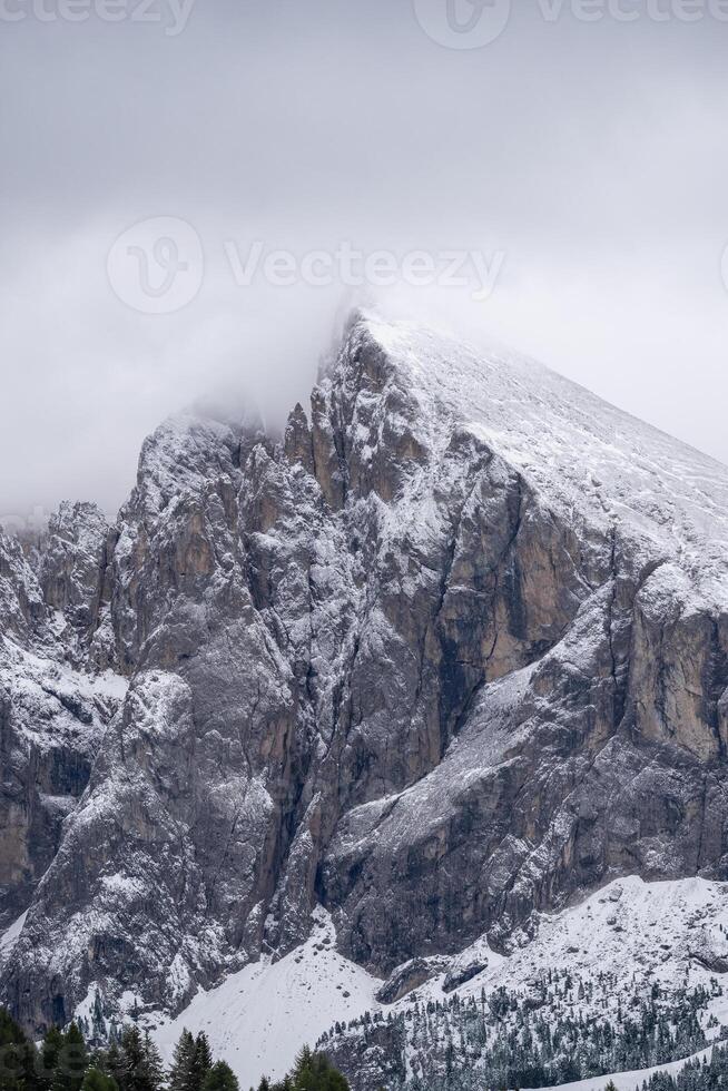View of fog with mountain peaks in the Dolomites, Italy. photo