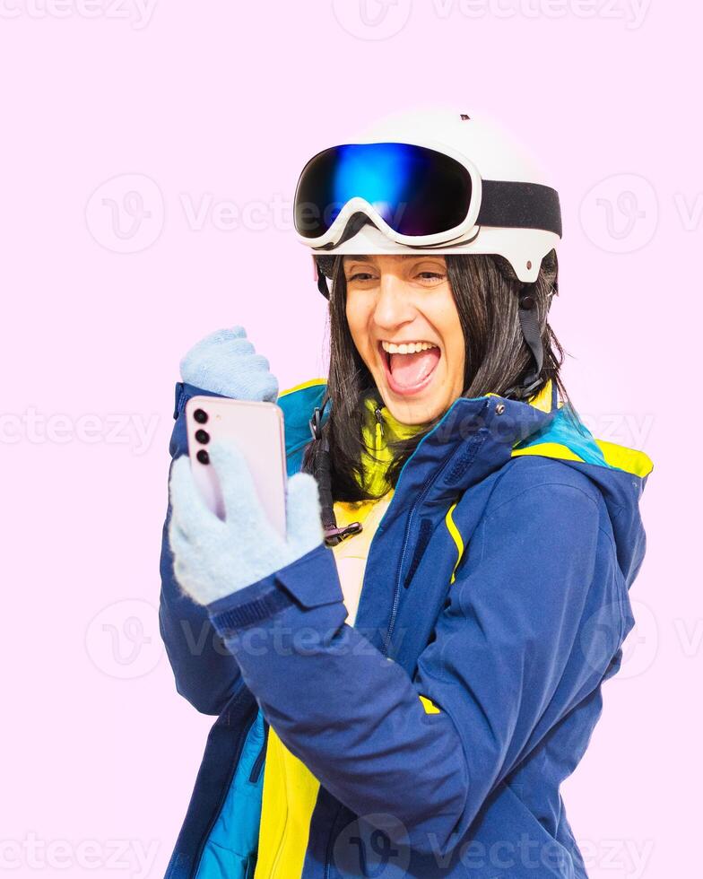 Photo of young beautiful smiling excited shocked positive girl using smartphone wear goggles isolated on red pink pastel color background