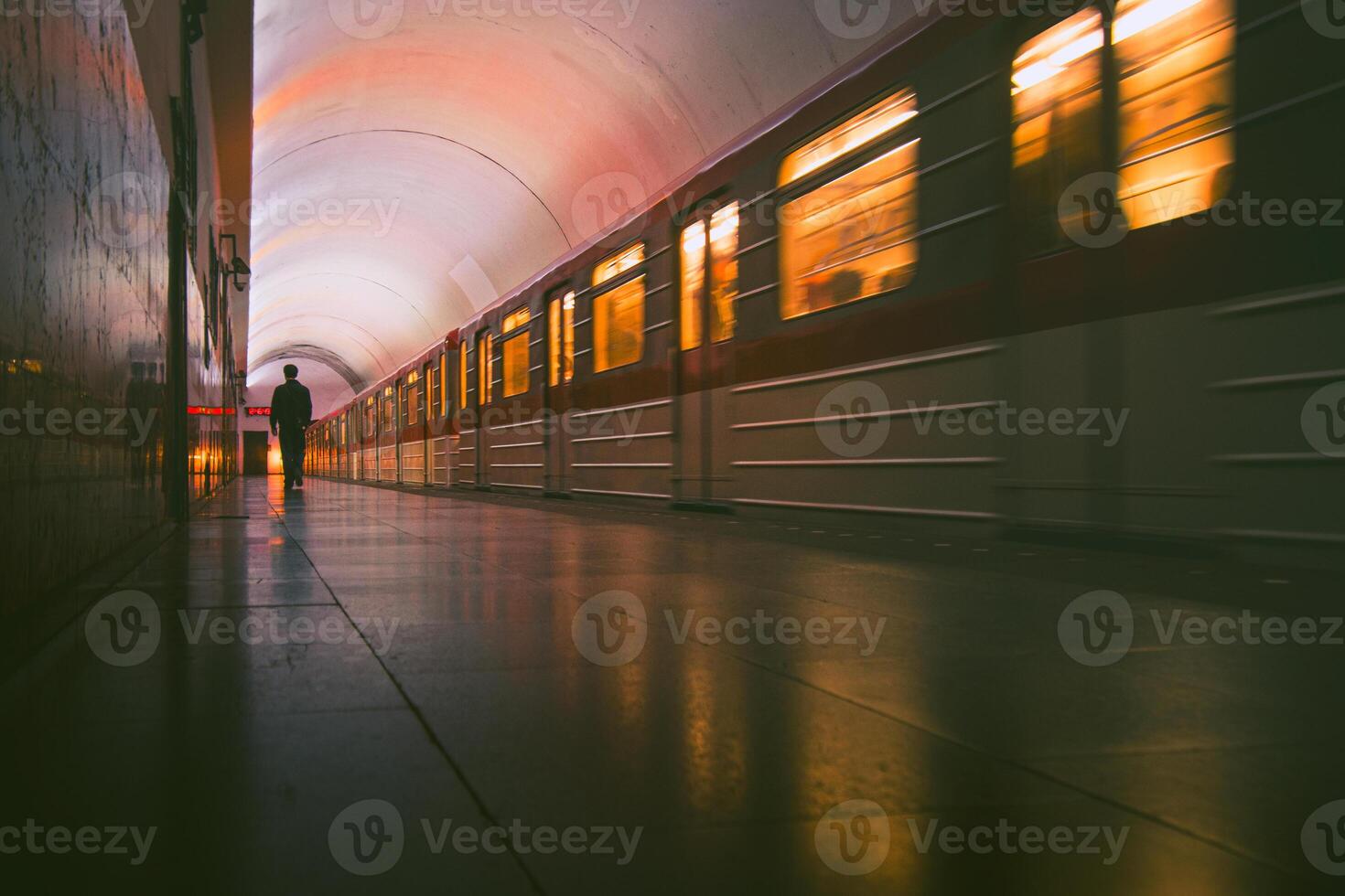 Passenger walk in alley tunnel platform underground in Rustaveli Metro station. Subway arrival or departure. Transportation traffic at night concept. Travel tourism in city Tbilisi, Georgia. photo