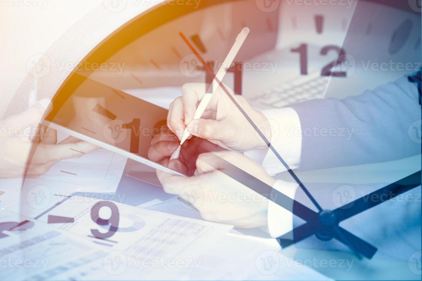 closeup businessman male hand digital signing contract for business investment deal project on tablet overlay time clock for precision timing goal success. photo