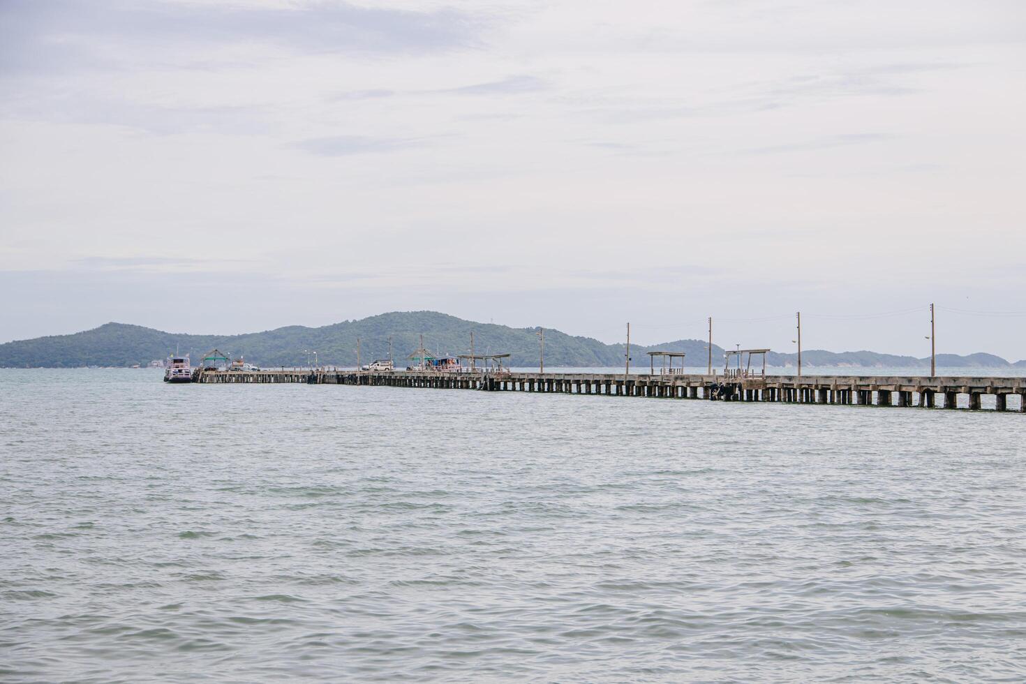 Concrete Bridge simple fishing port that stretches along out from the coast out to sea. photo
