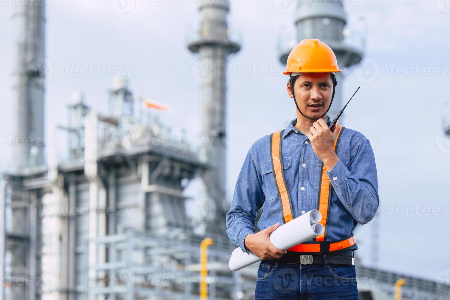 Petroleum Refinery industry engineer male working against oil and gas power industrial factory. Petrochemical power plant industry professional worker. photo