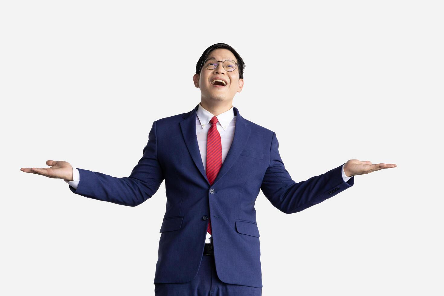 Businessman happy to receive money falling from above isolated on white. Business man gesture happy success wealth income incoming. photo
