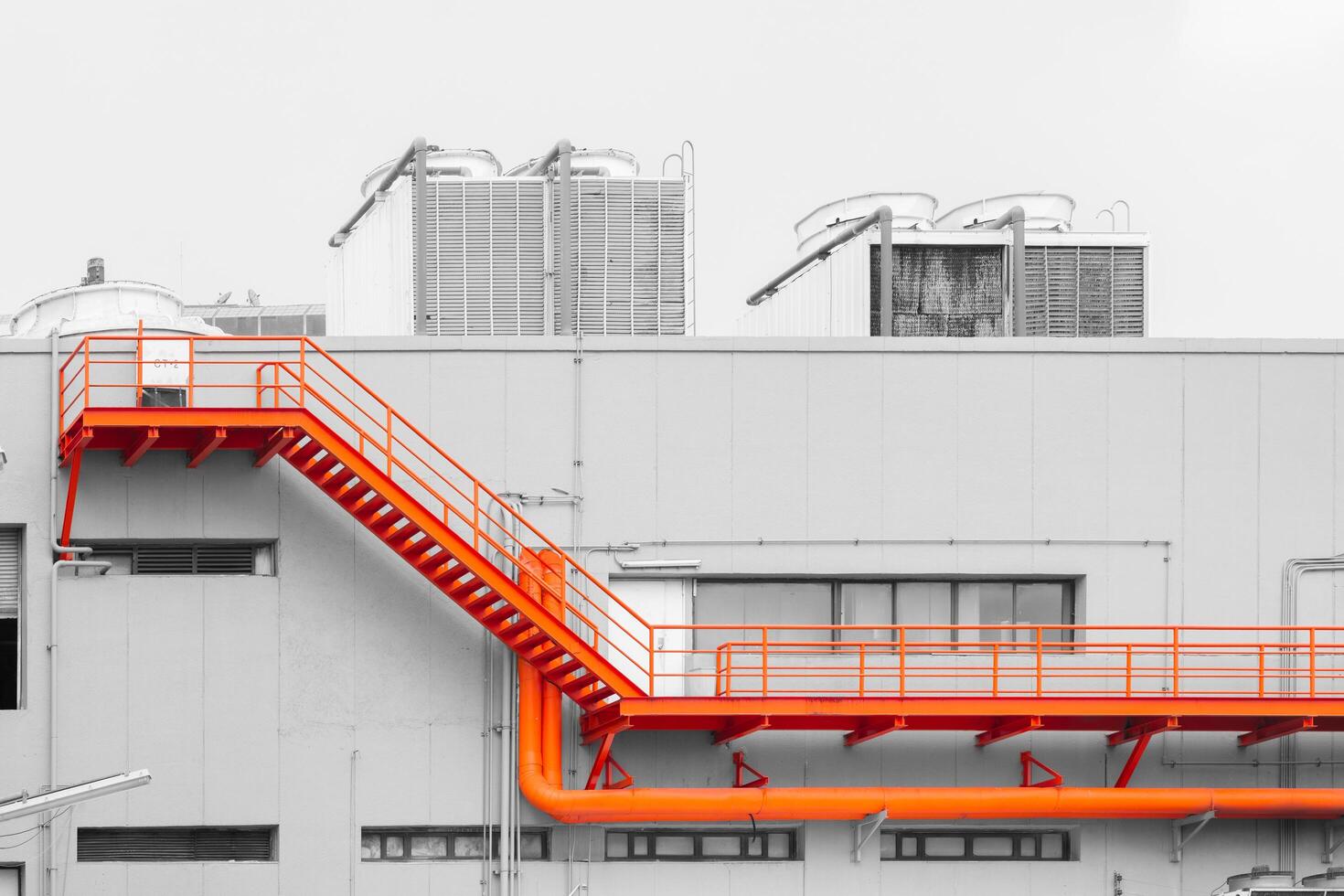 exterior industry building maintenance service walking space stair way for service or emergency exit with cooling tower at roof top photo