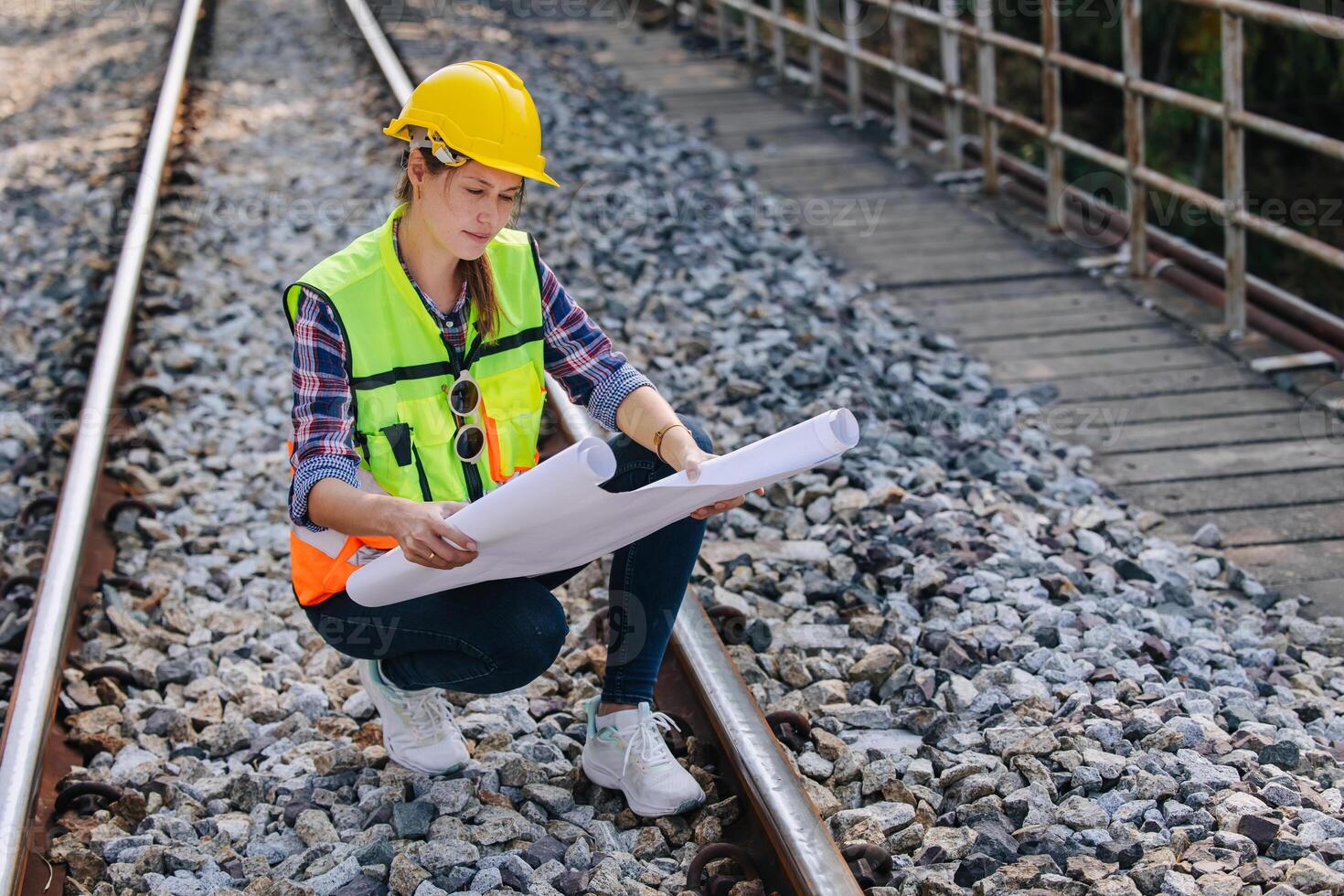 Engineer railway tracks construction service team working on site survey checking and maintenance inspection train track for safety photo