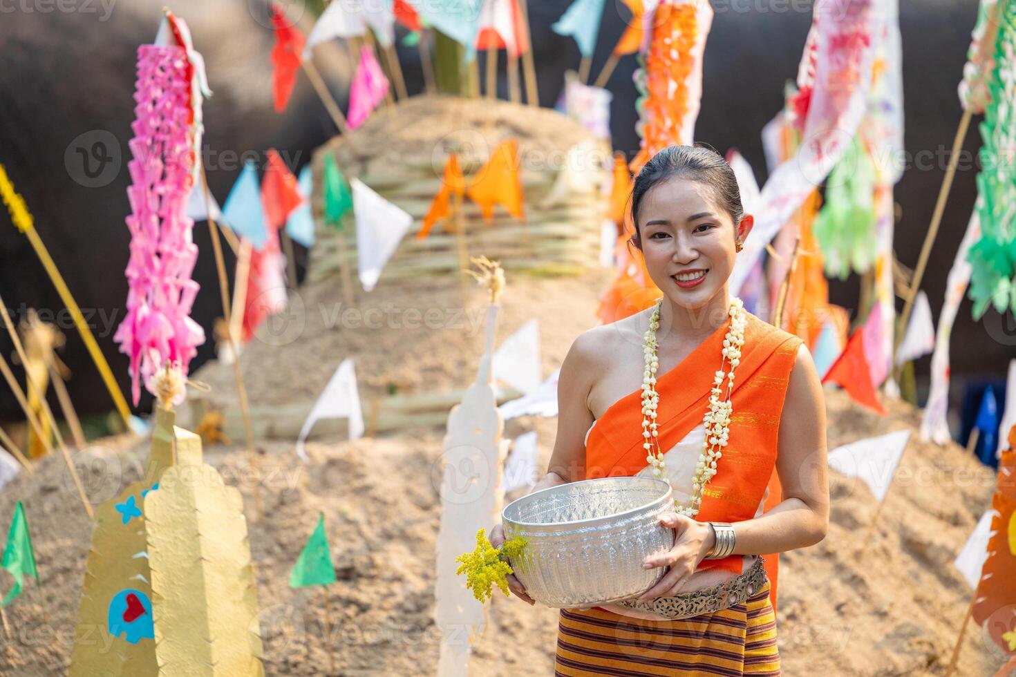 Songkran festival. Portrait Northern Thai people in Traditional clothes dressing handle handcrafted silver bowl in Songkran day summer Thailand cultural festival. photo