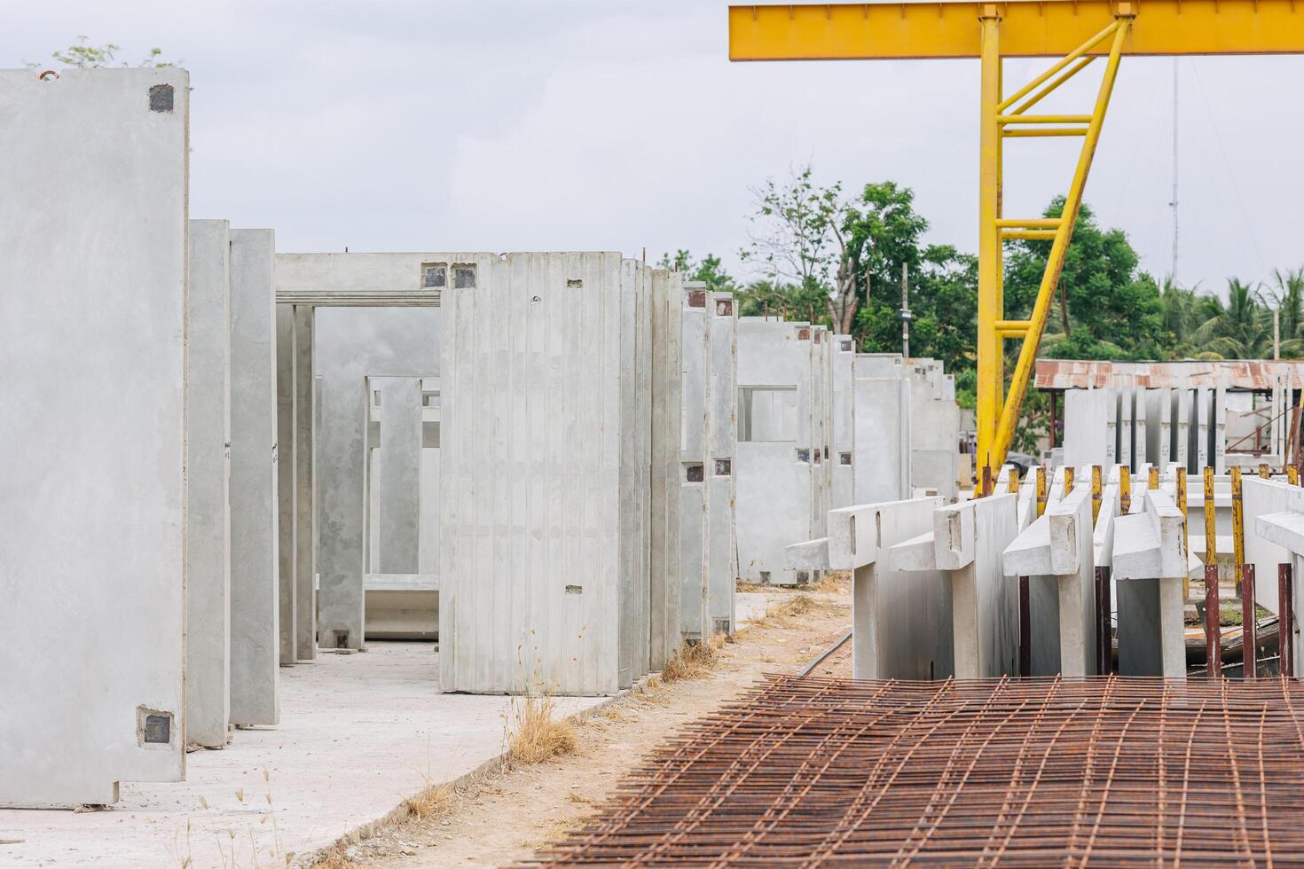 Precast concrete casting manufacturing plant, Cement products large construction site yard business industry. photo