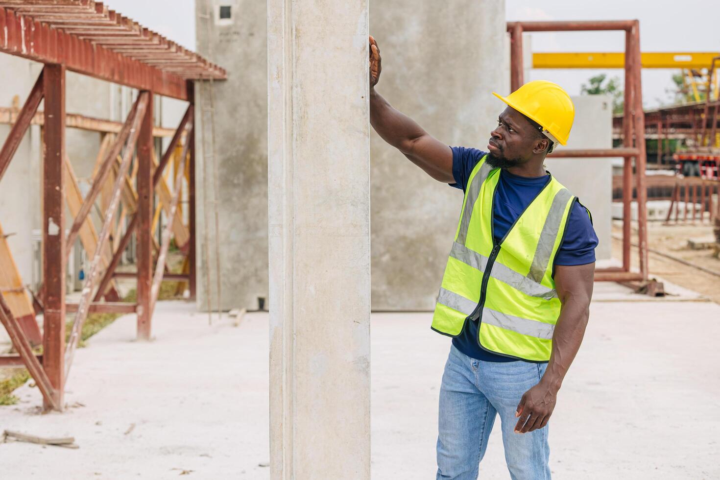 African black engineer worker working in Precast concrete casting manufacturing checking product quality standard outdoor construction site photo