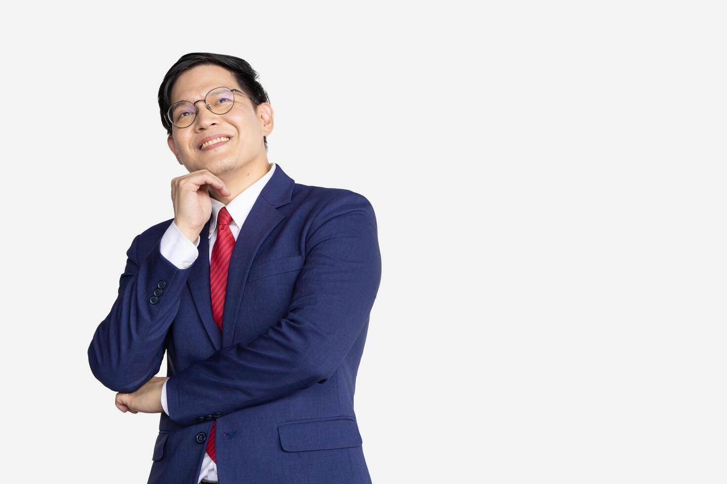 Businessman Asian model isolated on white background. Smart male in business suit expression think vision dream. photo