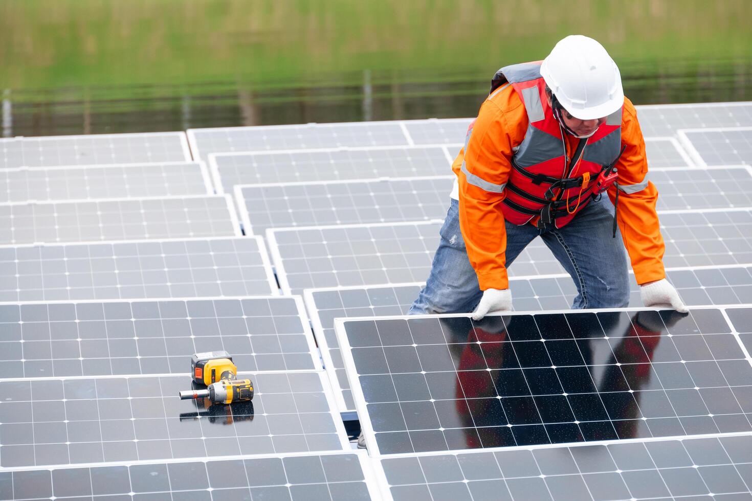 Professional Engineer Service Floating Solar Panel. Worker Maintenance Cleaning Replacing Solar Panel. Solar photovoltaic panel system in Industry lake. Saving Energy with Clean Power. photo