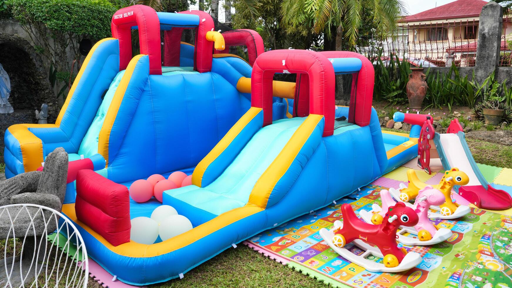 a large inflatable slide with a small inflatable slide photo
