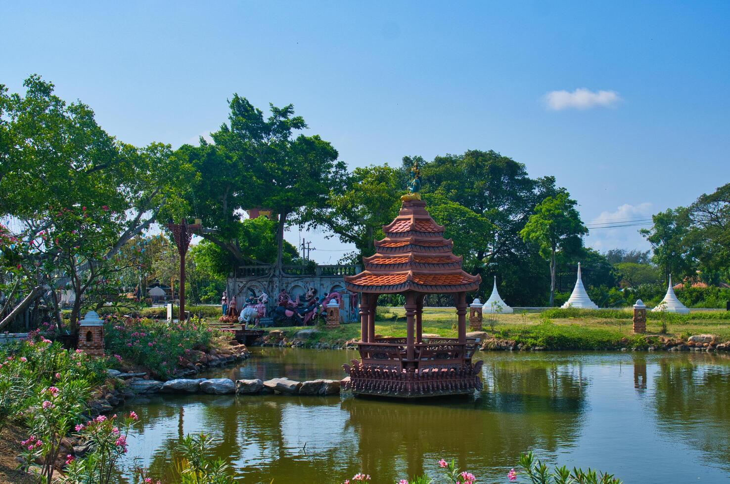a pond with a gazebo photo