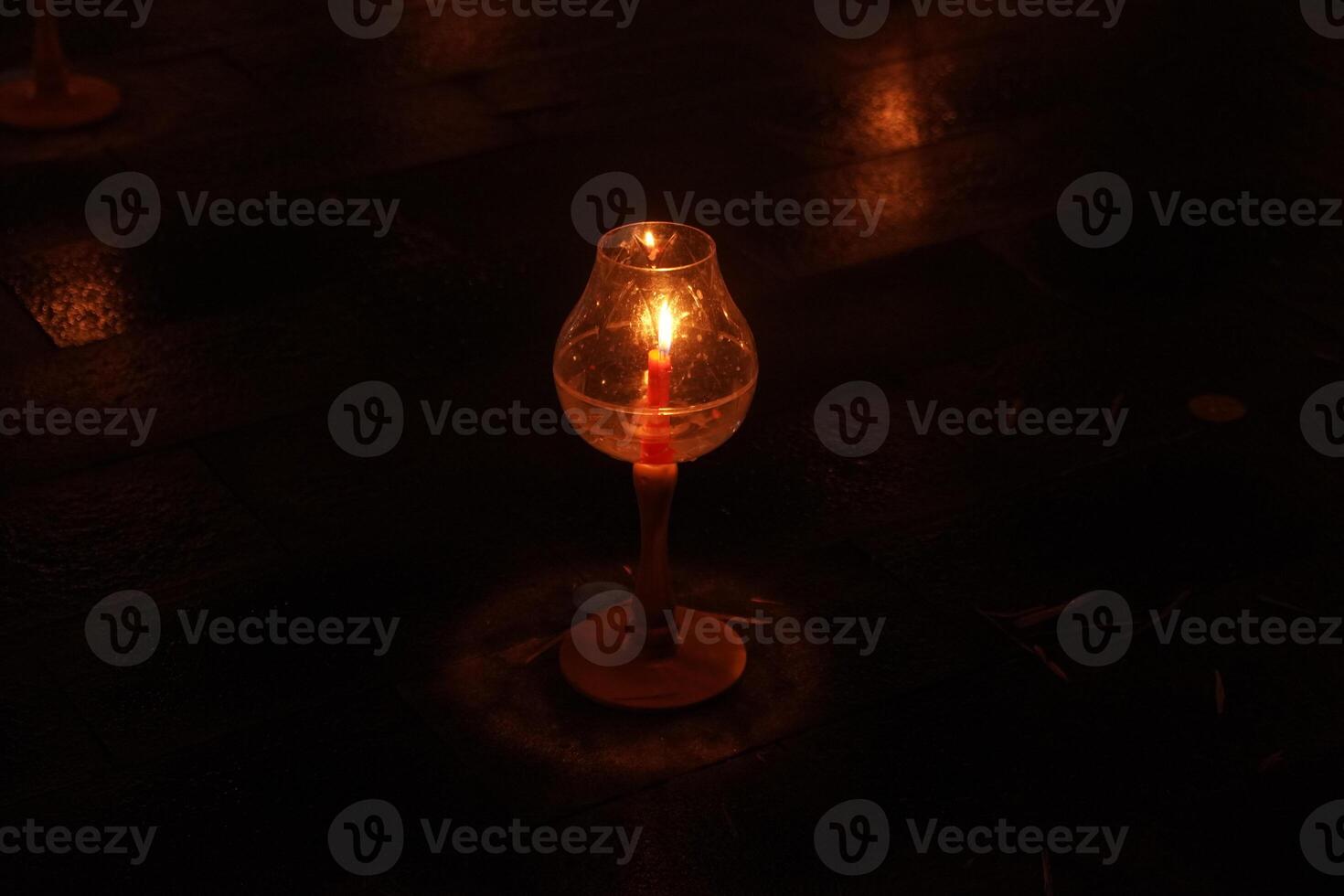 A large number of candles are lit for Vesak Day ceremony in Borobudur Temple, arranged in a row. photo