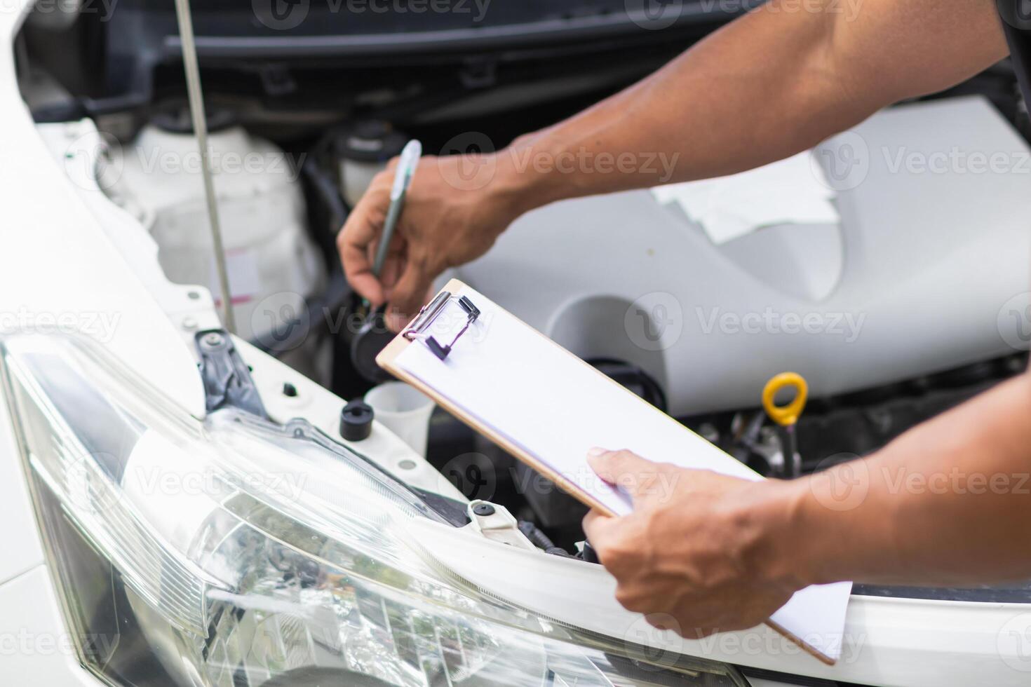 car service center mechanics are checking condition car and engine make sure they are ready use and in perfect condition according center warranty. periodic vehicle inspections for safety in driving. photo