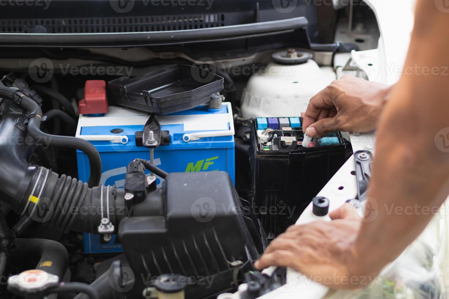 car service center mechanics are checking condition car and engine make sure they are ready use and in perfect condition according center warranty. periodic vehicle inspections for safety in driving. photo