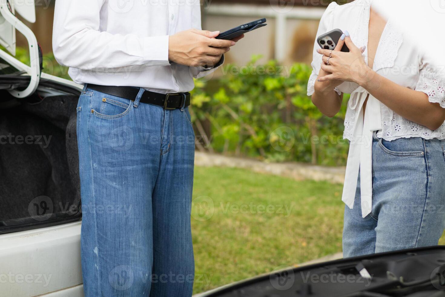 salesman is checking condition of car before delivering it to customer to ensure the quality and service after agreeing to sales contract. concept of checking the condition of the car for confidence photo