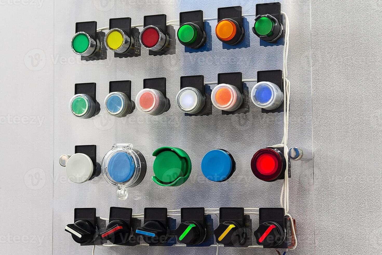 Various electrical button switches on an exhibition stand photo