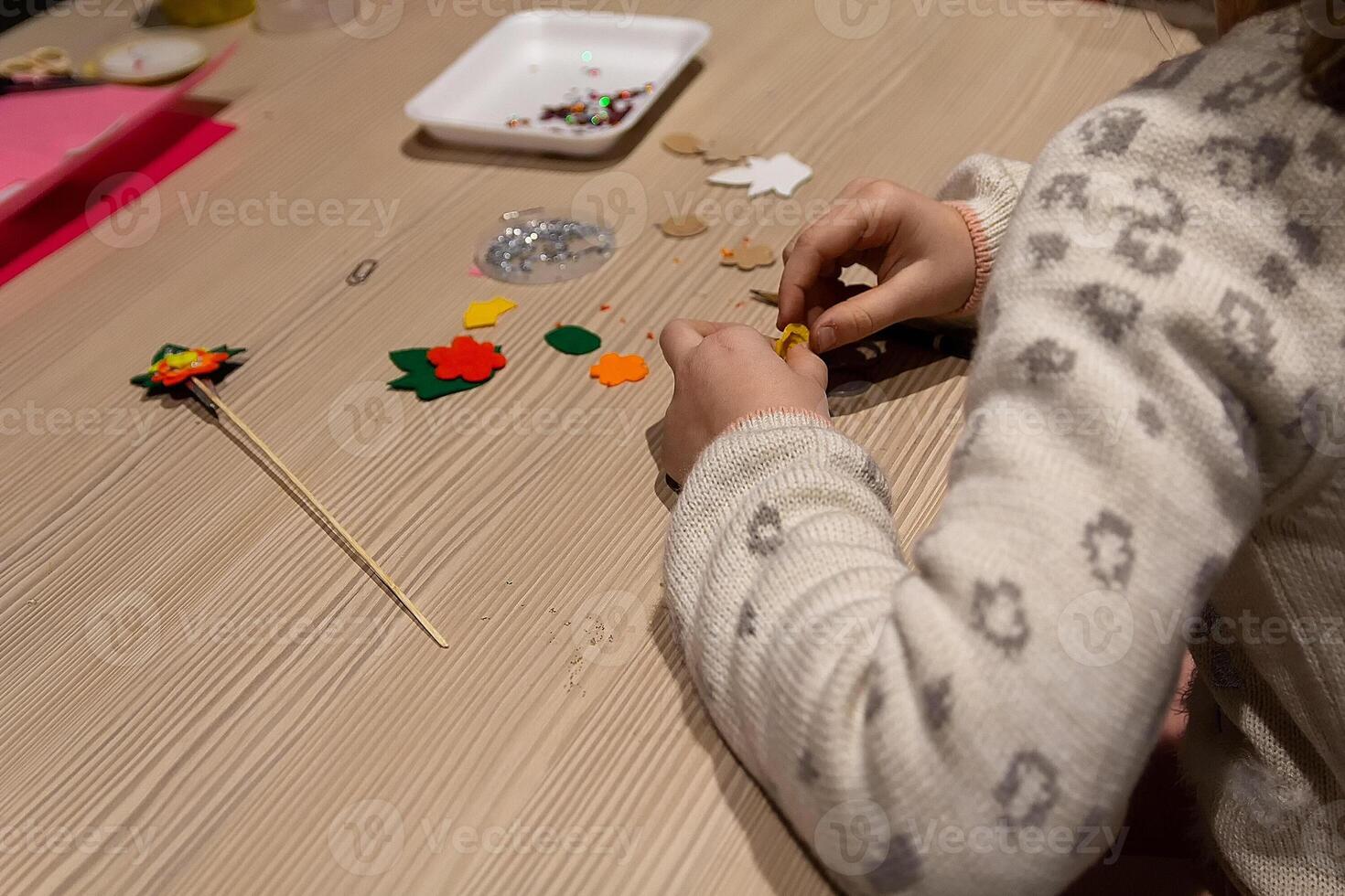 Children crafting Christmas tree from paper photo