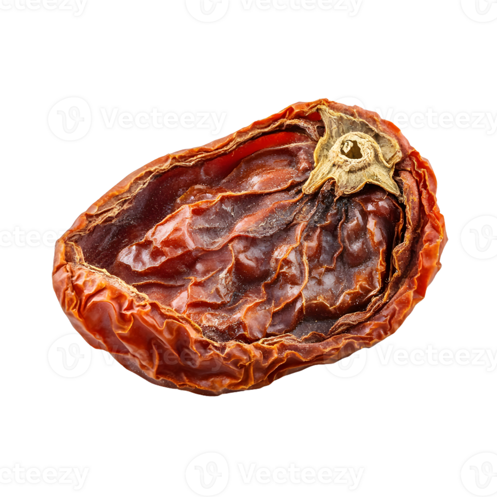 A close-up of a single, sun-dried tomato with a wrinkled surface and a visible stem scar, isolated against a white background. png
