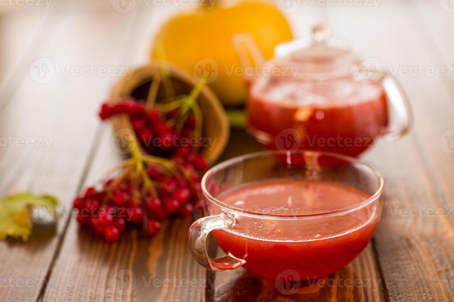 tea from ripe red viburnum on a wooden table photo