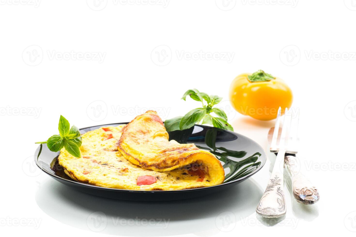 fried omelette with sweet pepper and vegetables in a plate, isolated on white background . photo