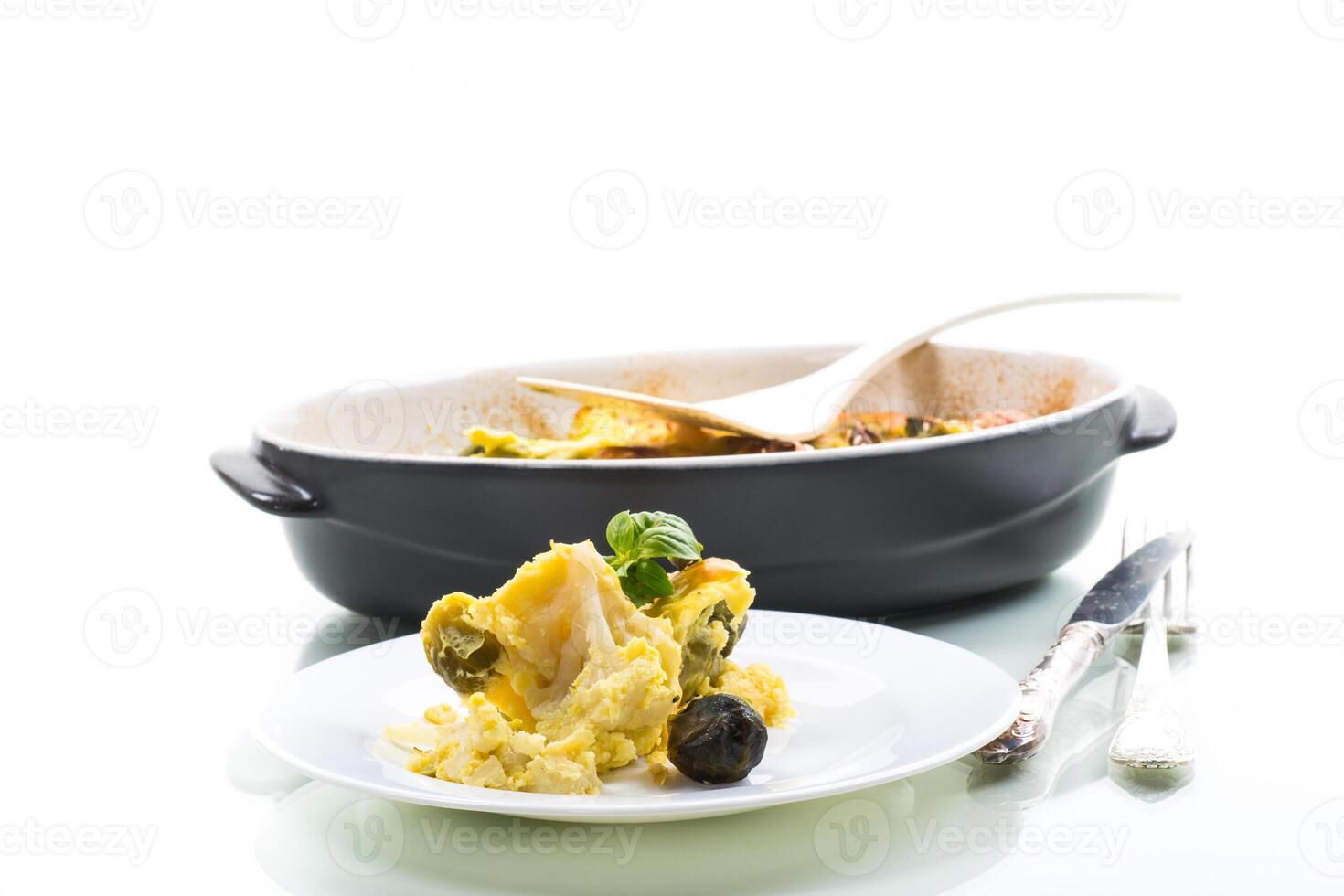 cauliflower and brussels sprouts casserole with cheese in a plate photo