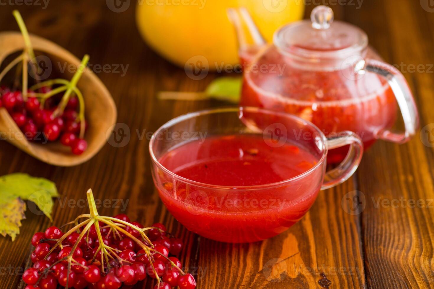 tea from ripe red viburnum on a wooden table photo