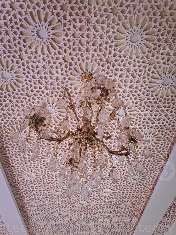 Essence of Arabian artistry with this exquisite chandelier and complex intricate patterns and ornate photo