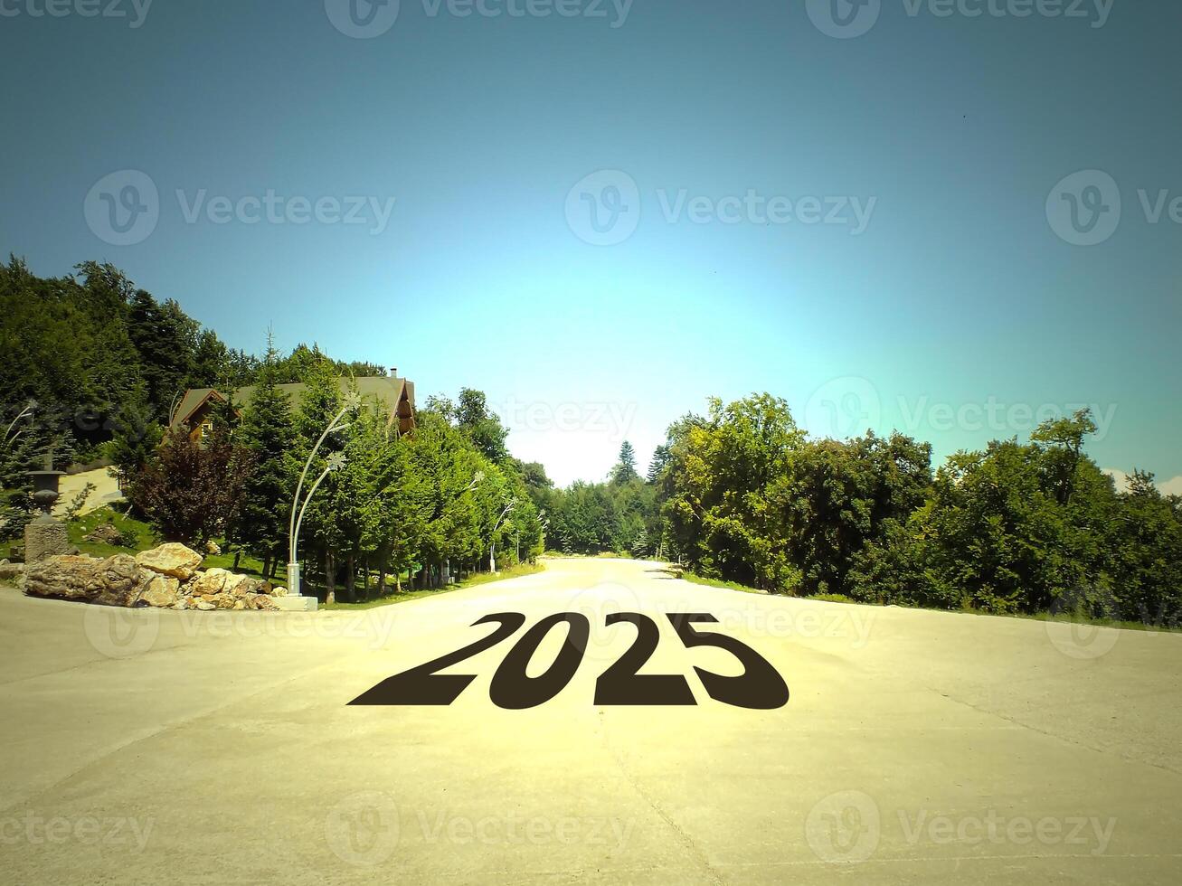 Concept for new year vision 2025. New year resolution ideas for 2025. 2025 written on an empty road and beautiful landscape. photo