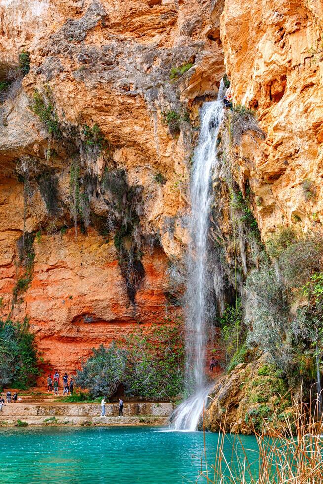 Spain, Valencia, March 29, 2024. Waterfall in Valencia in spring, rock climbing photo