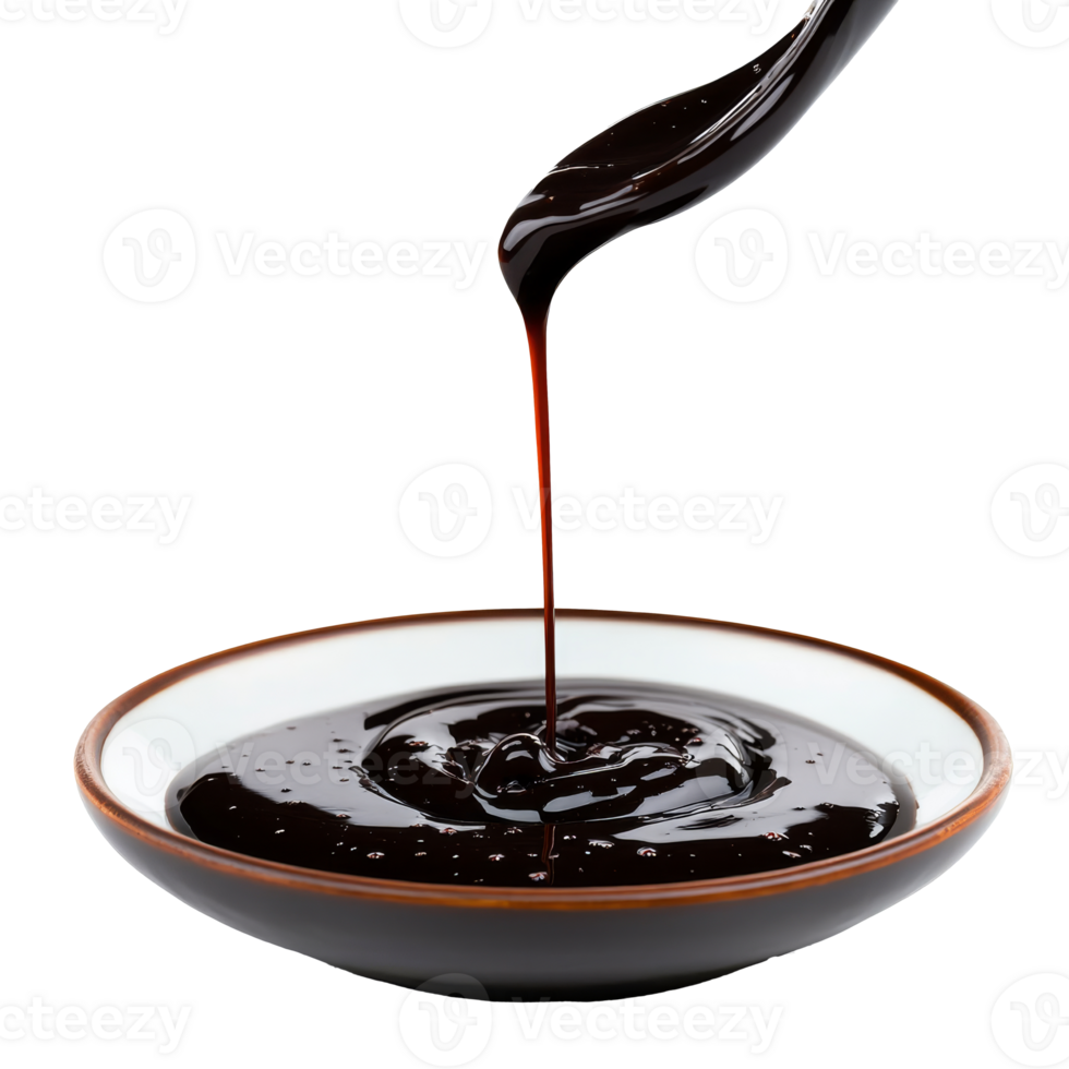 Thick dark sauce being poured into a white bowl png