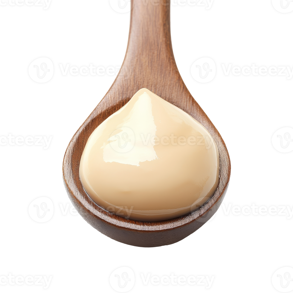 Creamy condiment on a wooden spoon ready to use png